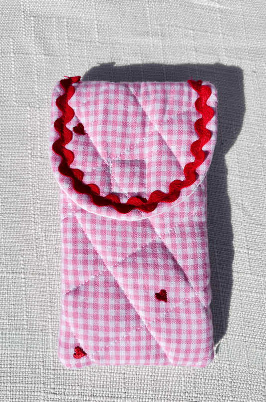 Handmade pink gingham quilted glasses case with embroidered red hearts and red rickrack trim perfect for valentines day or teachers day gift