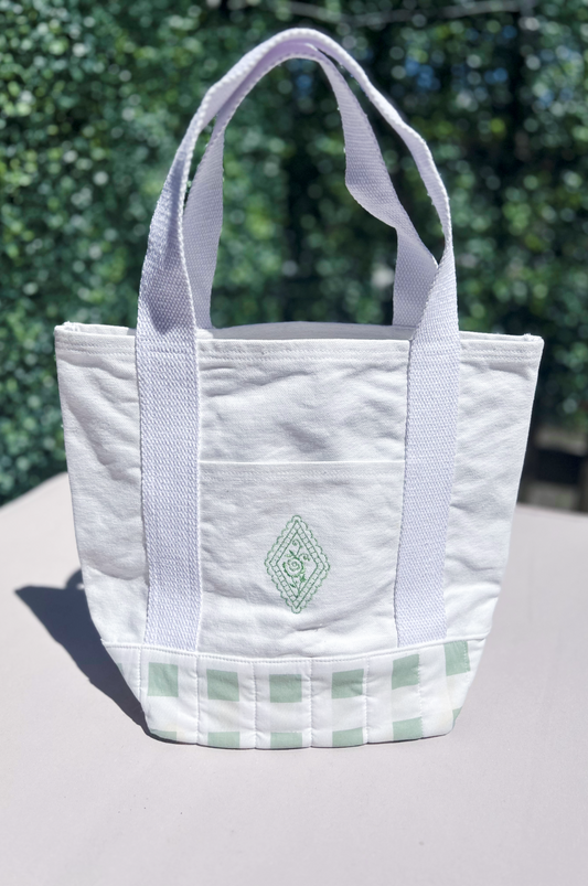 Mint green gingham canvas tote bag with diamond and floral shaped embroidery detail on the front pocket, 100% cotton canvas